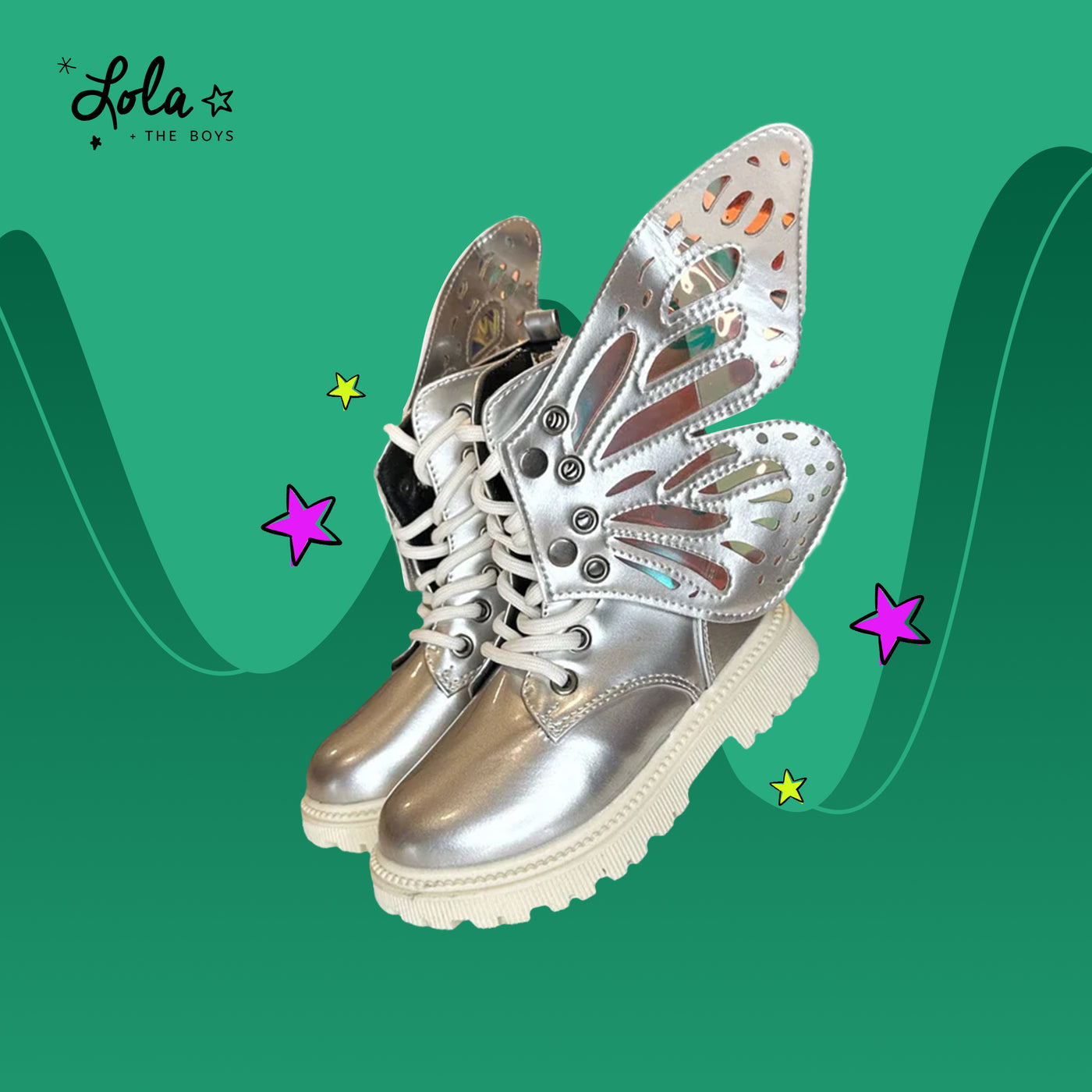 Mom and daughter styled with bold and sparkling Wicked accessories, featuring coordinated outfits from Lola and the boys