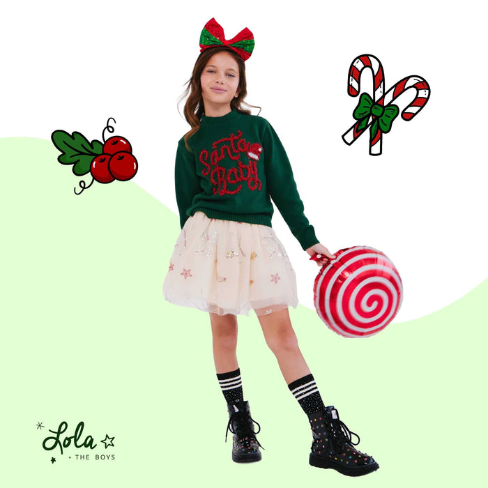 Girl wearing sequin jacket and tutu skirt outfit for holiday photos