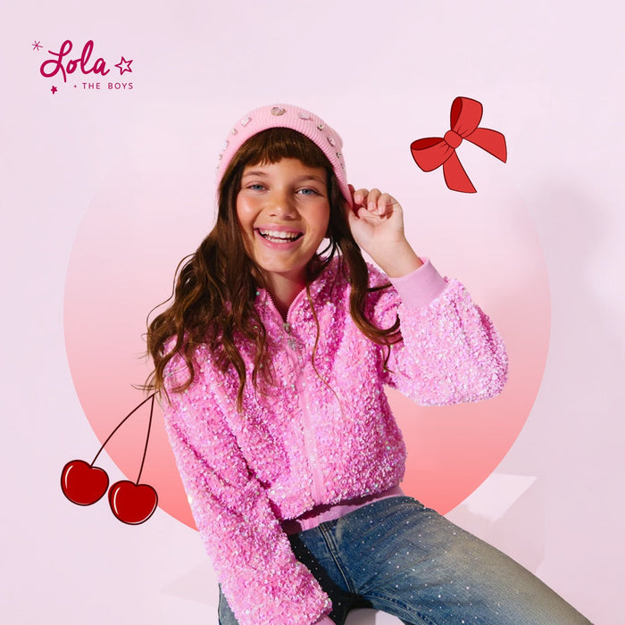 Girl wearing cherry and bow outfits kids set with sparkly jacket and hair bow