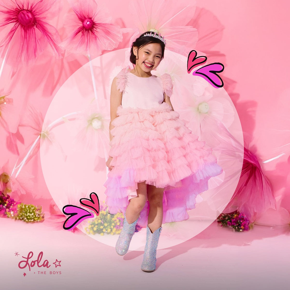 A stylish young girl wearing a cool and trendy sequin bomber jacket from Lola + The Boys, a popular store for cool kids clothing in Chicago