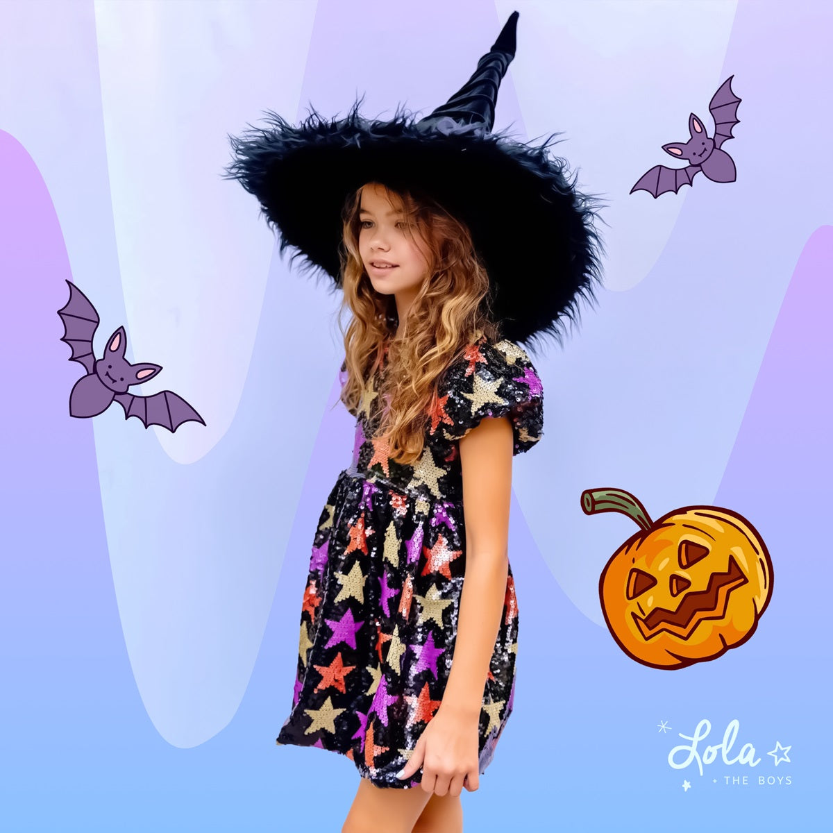 Girl in sequin star dress and crystal tiara holding rainbow crystal purse at a Halloween party