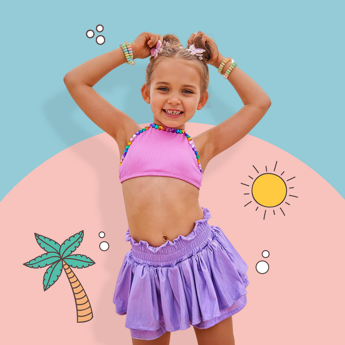 Kids’ pool party outfits from Lola and the Boys featuring colorful swimsuits, trendy summer dresses, and fun accessories for children’s pool parties